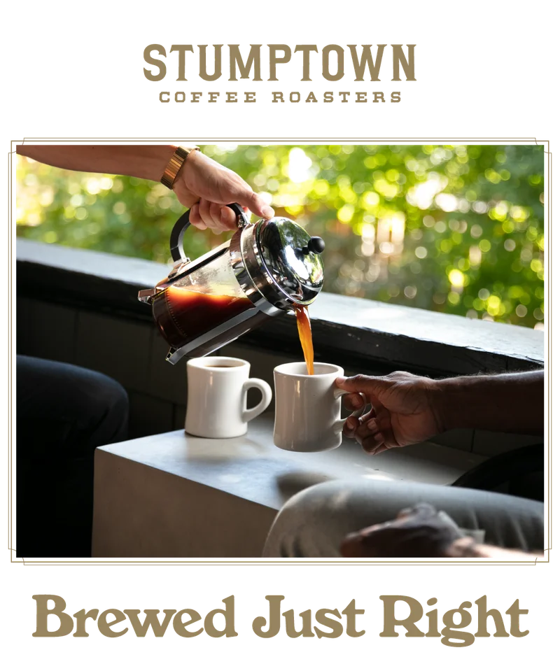 French press coffee poured into a mug between two people. Text reads “Brewed Just Right.”