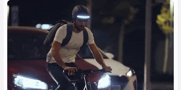 Man riding a bike at night