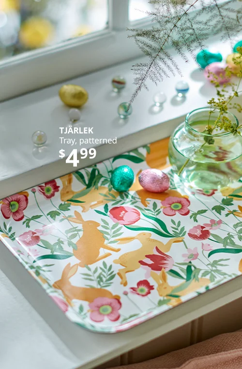 A colorful tray with a vase.