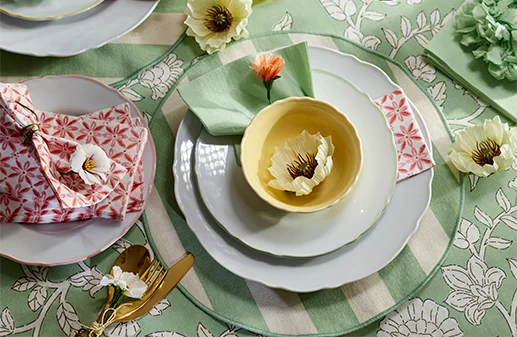 Overhead of yellow cup on spring table setting.