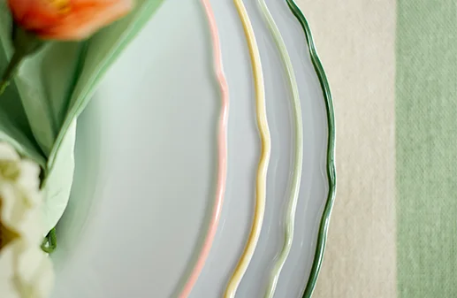 Close up of white plates with pastel rtrim
