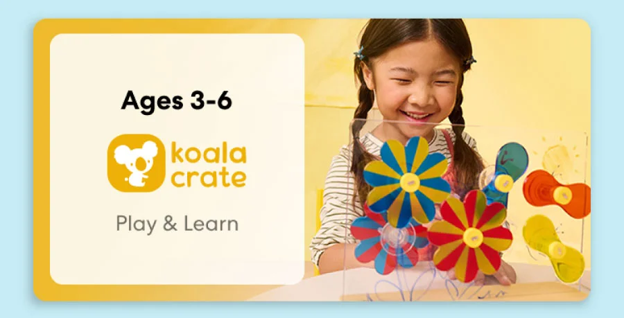 Young child smiling while working on creative KiwiCo Sprout projects, perfect for ages 3–6 for play and learn.