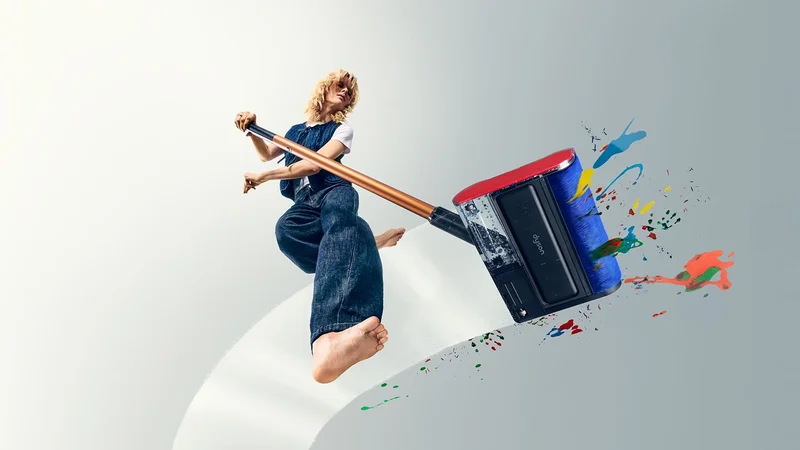 The Dyson PencilWash wet cleaner is used to clean stains from a hard floor