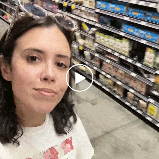 Hands getting pills out of a bottle