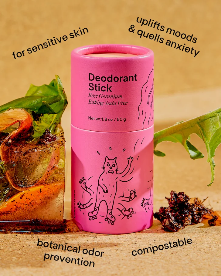 A pink deodorant stick with a block of compost beside it