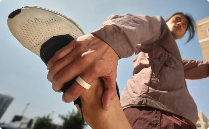 Person holding their ankle wearing Oura Ring 4