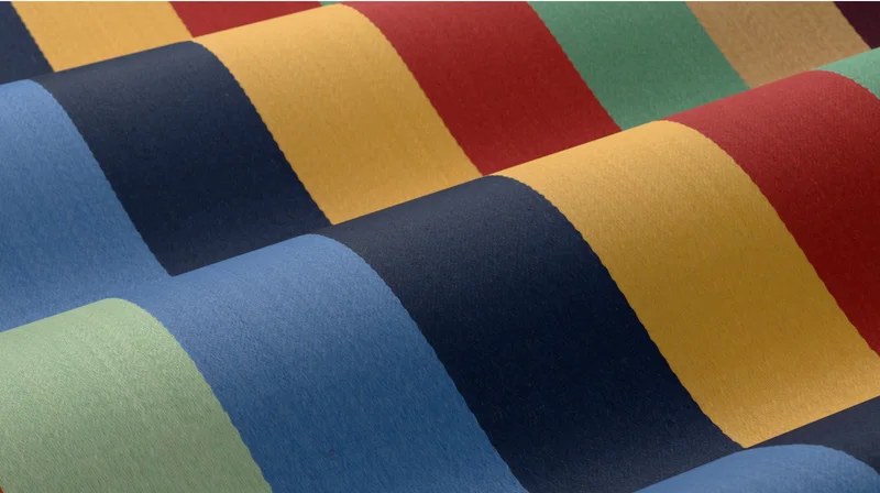 Banner Stripe’s archetypal pattern features distinct bands of clear hues, unified in scale across a smooth surface