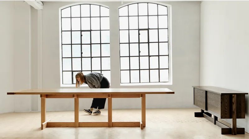 Land Collection: Designer Stine Aas admires the Land Table and Credenza in her Norway based studio.