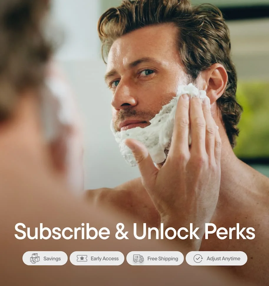 Man using shaving cream on face