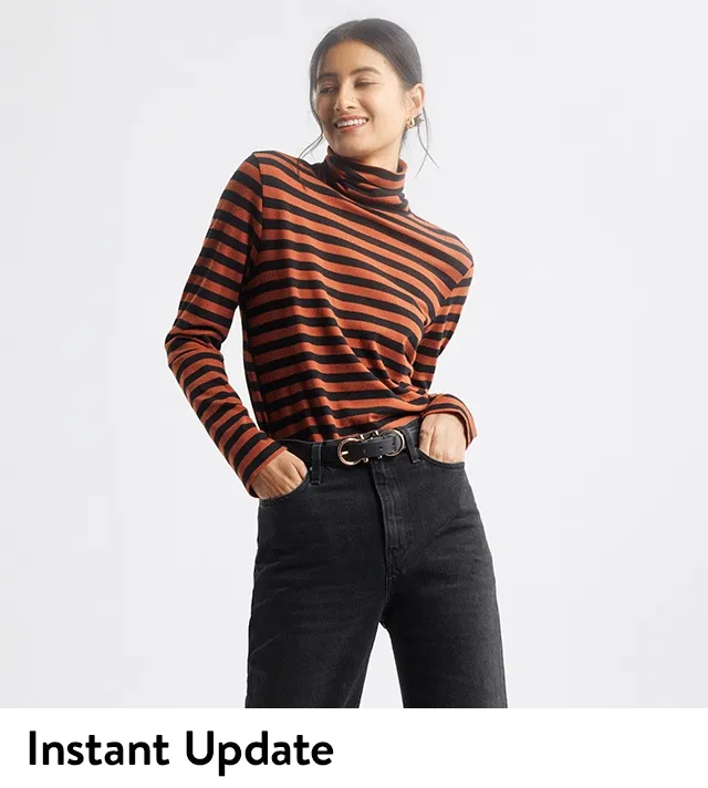 A woman in a red and black striped turtleneck.