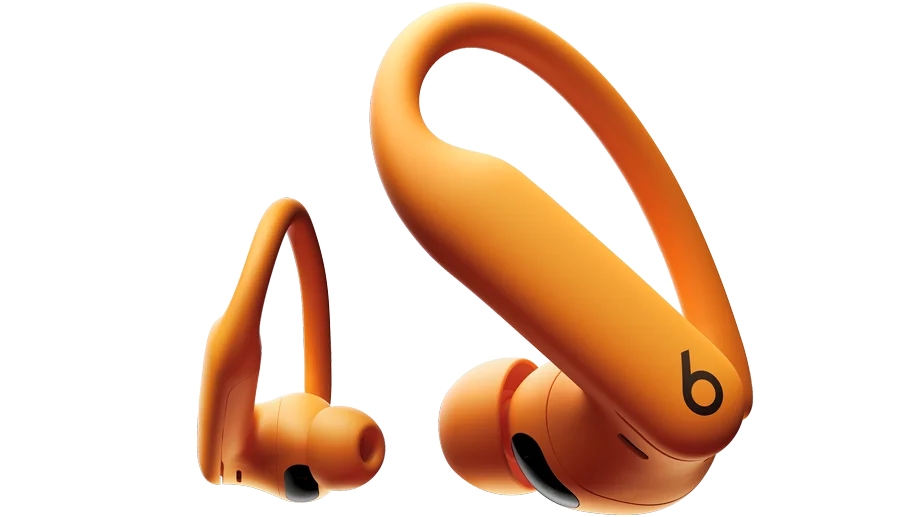 A pair of orange Powerbeats Pro 2 wireless earbuds with ear hooks and the Beats logo are displayed against a white background.
