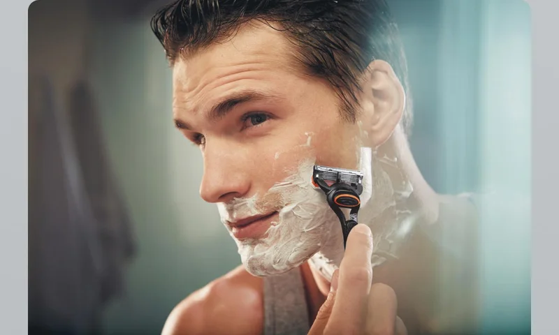 Man shaving his face with Gillette razor