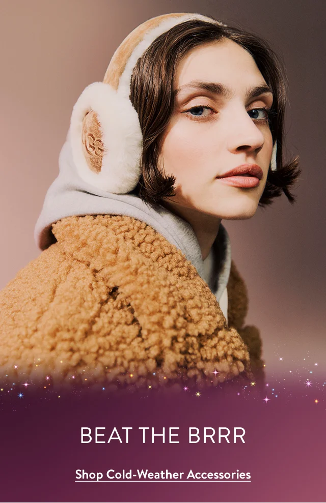 Woman wearing UGG earmuffs. Hat and scarf.