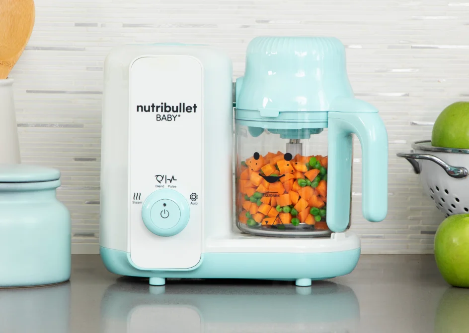 nutribullet Baby Steam + Blend filled with carrots and green peas