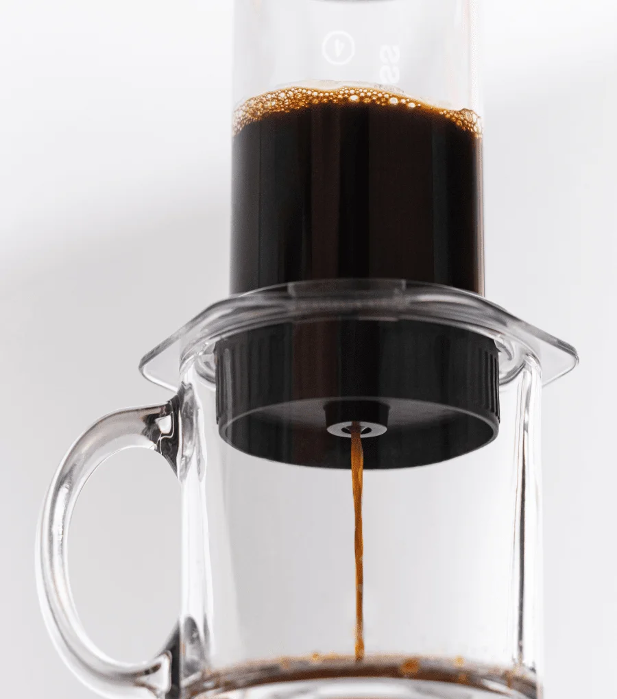 Image of coffee going through the AeroPress Flow Control Filter Cap