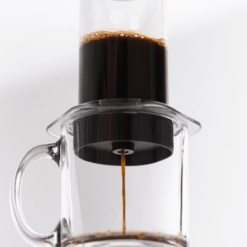 Image of coffee going through the AeroPress Flow Control Filter Cap