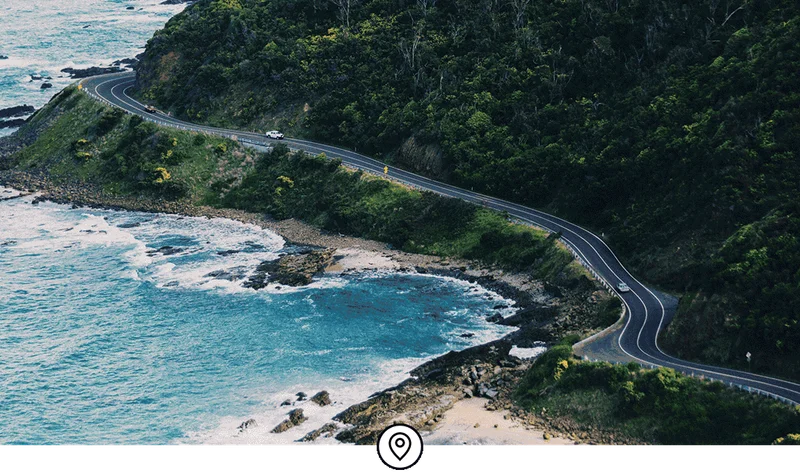 Image Description: A winding road that follows the coast in Australia