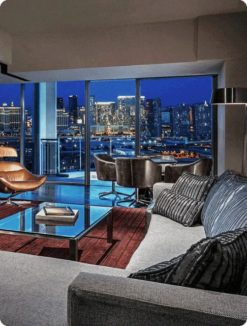 Image Description: Interior of a suite with sleek furniture and a balcony overlooking the city at Palms Place Hotel And Spa