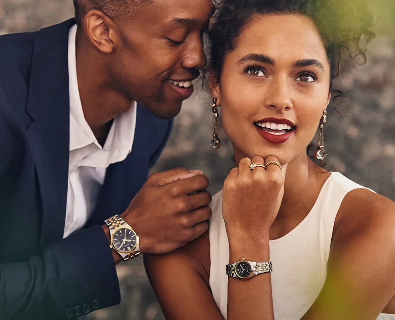 A couple wear matching His and Hers Classic Corso timepieces for their engagement pictures.