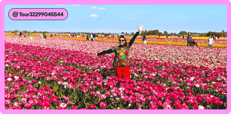 Image description: A woman in a colorful outfit standing in a field of pink and red tulips, photo taken by @Tour32299045544