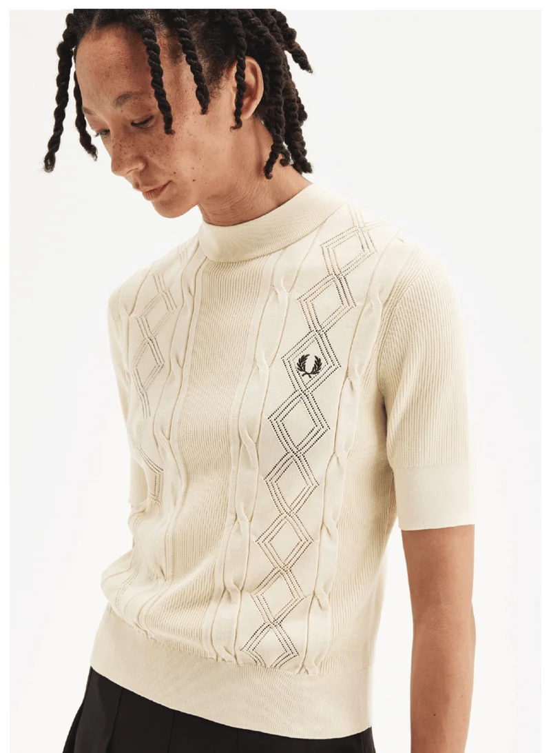 women's cream lightweight knitted top with cut-out detailing and a high neck