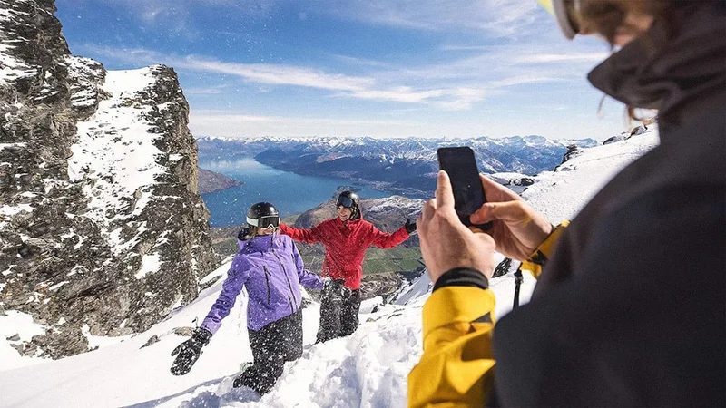 Image description: Skiers posing for photos at The Remarkables, Queenstown.