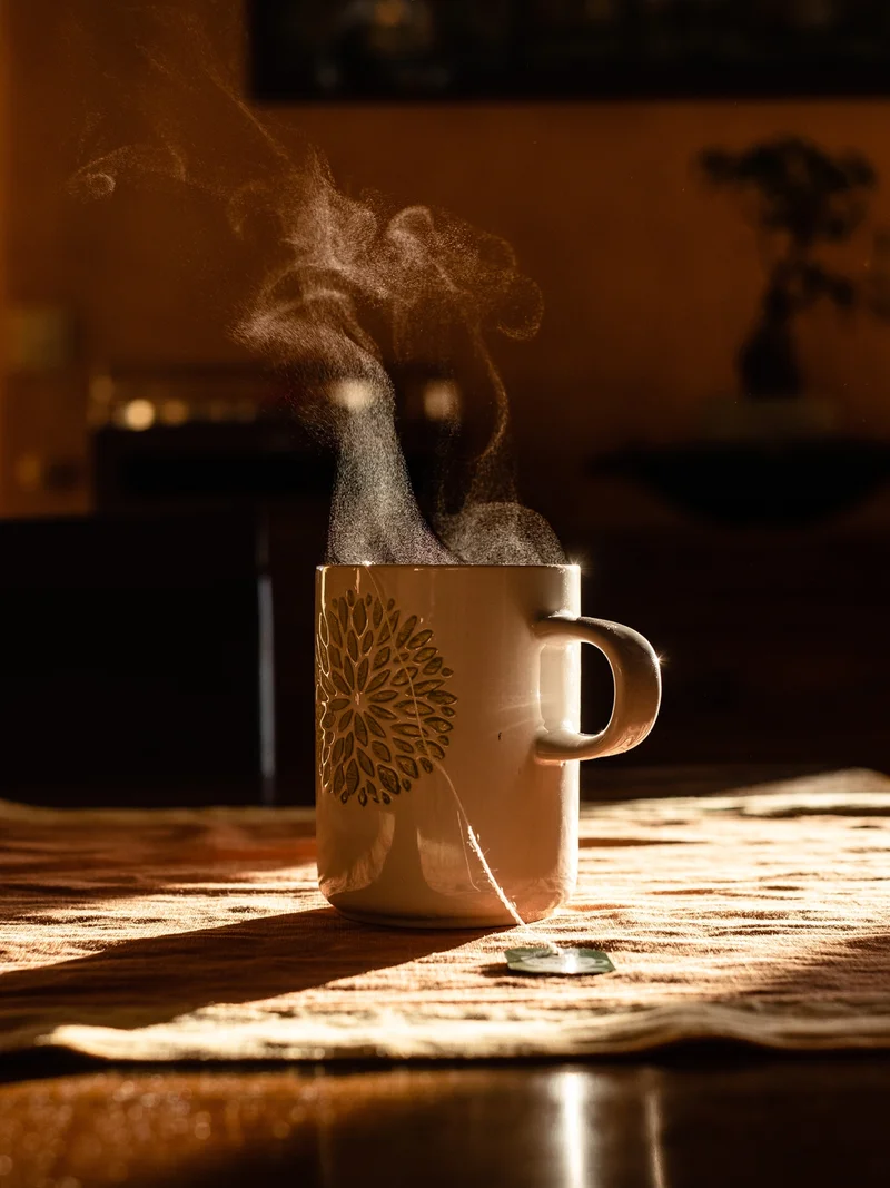 France, Occitania, Haute-Garonne, Toulouse, 2023-01-04. Illustration of an herbal tea with smoke coming out of the cup in a ray of light. Photograph by Lilian Cazabet / Hans Lucas.
