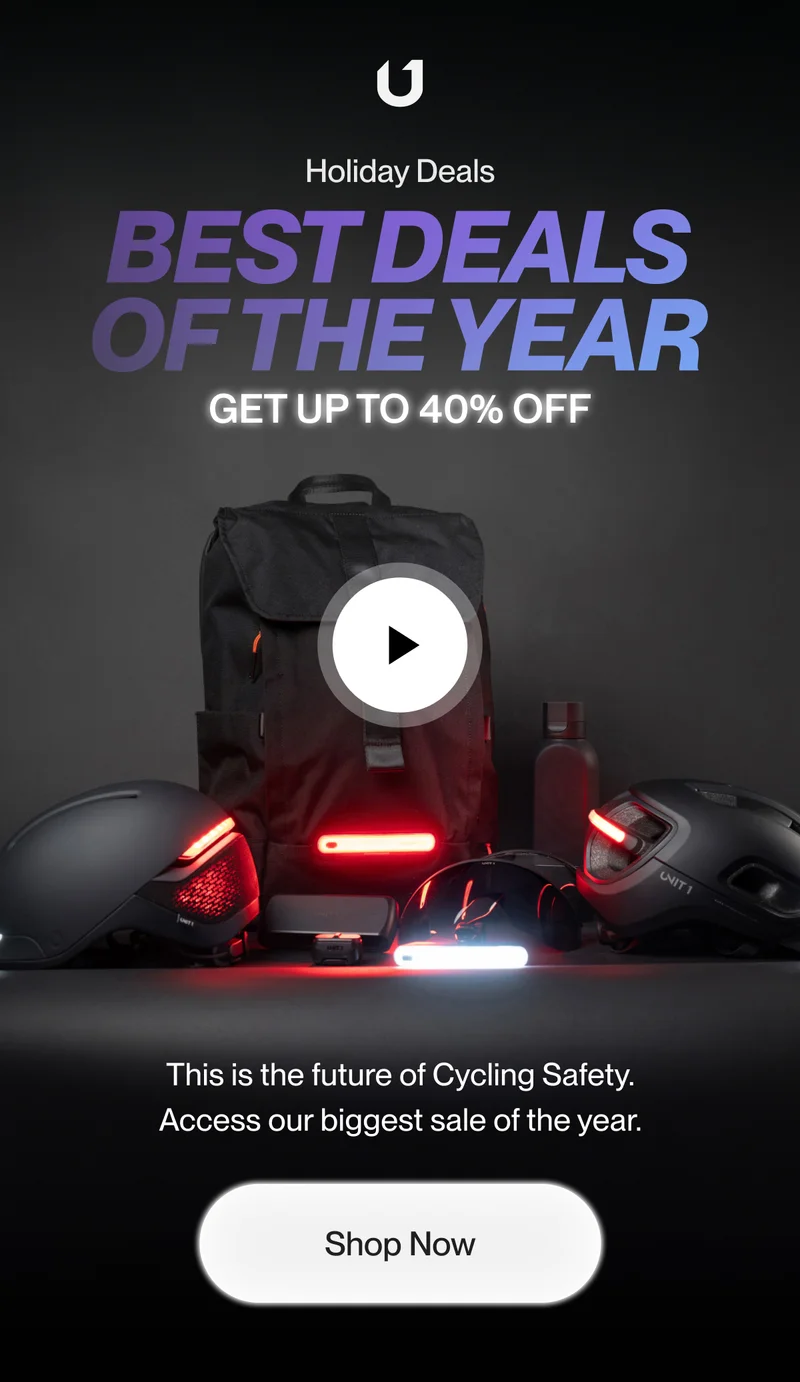 Man wearing a bike helmet with integrated lights.