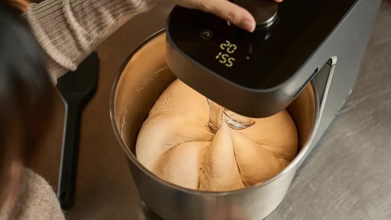 Ooni Halo Pro Spiral Mixer mixing dough into a pumpkin shape