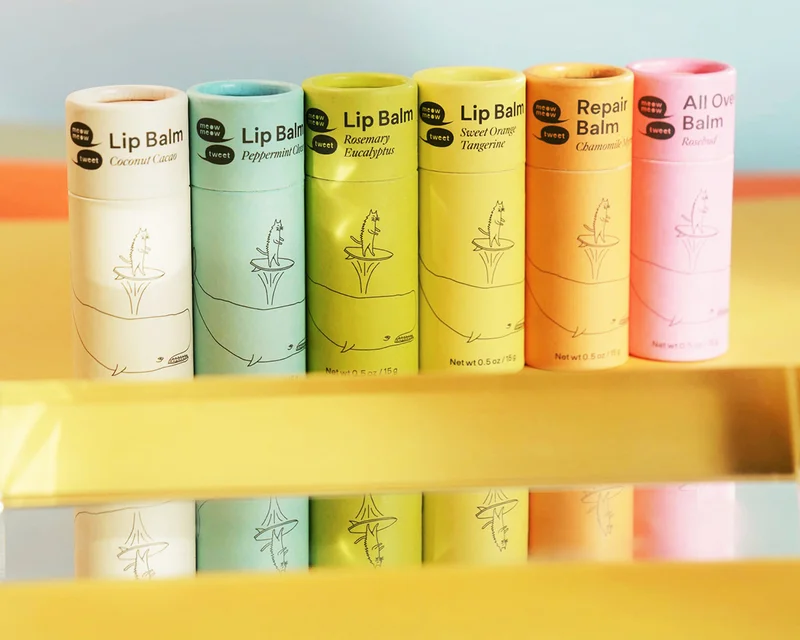 A line up of our lip balms in a rainbow of colors