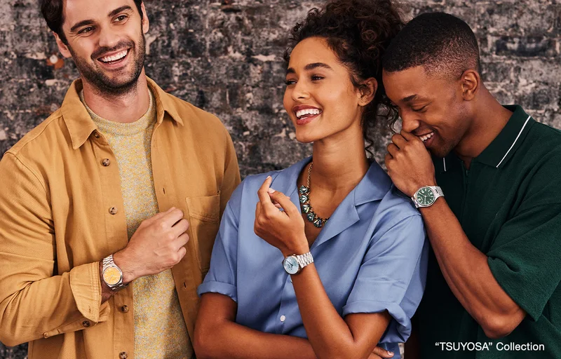 People smiling and wearing styles from the "TSUYOSA" collection.