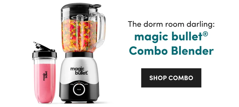 A silver and black magic bullet blender filled with chopped vegetables stands next to a clear cup containing a pink smoothie.