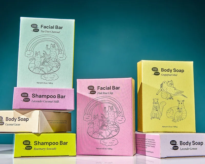 A collection of colorful paper soap boxes on a blue background