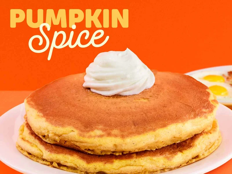 Two Pumpkin Spice pancakes with whipped topping