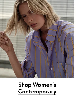 A woman wearing a striped button-up shirt.