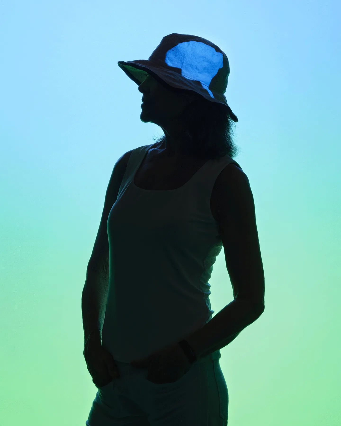 A woman against a light green background, with heart, arms, and brain highlighted