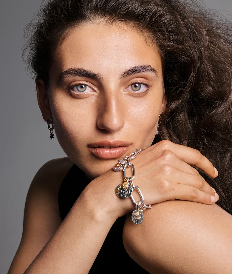 Model styled in mixed metal Pandora Talisman bracelet