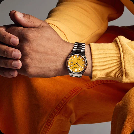 Man wearing TSUYOSA yellow dial watch