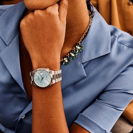 Woman wearing TSUYOSA blue dial watch