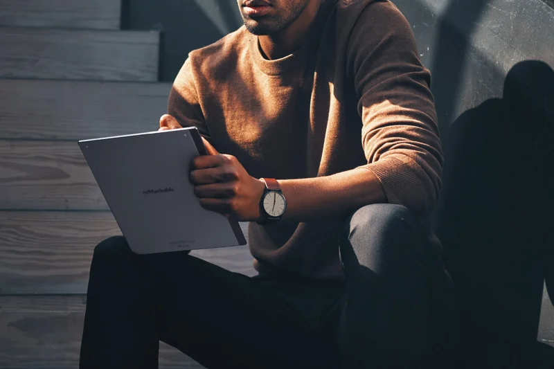 Close-up image of a man using a reMarkable tablet