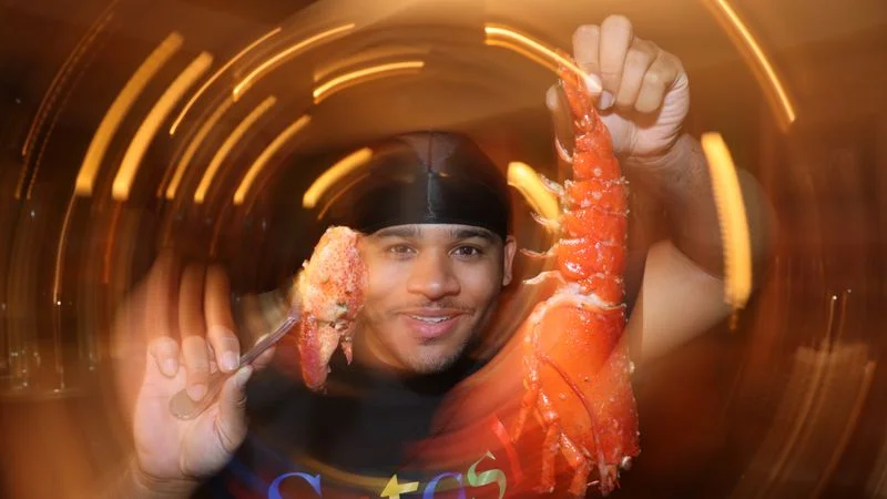 Image may contain: Photography, Animal, Food, Invertebrate, Lobster, Sea Life, Seafood, and Person