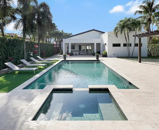 Enjoy sun-drenched days by the pool in a modern vacation rental in Miami, Florida.