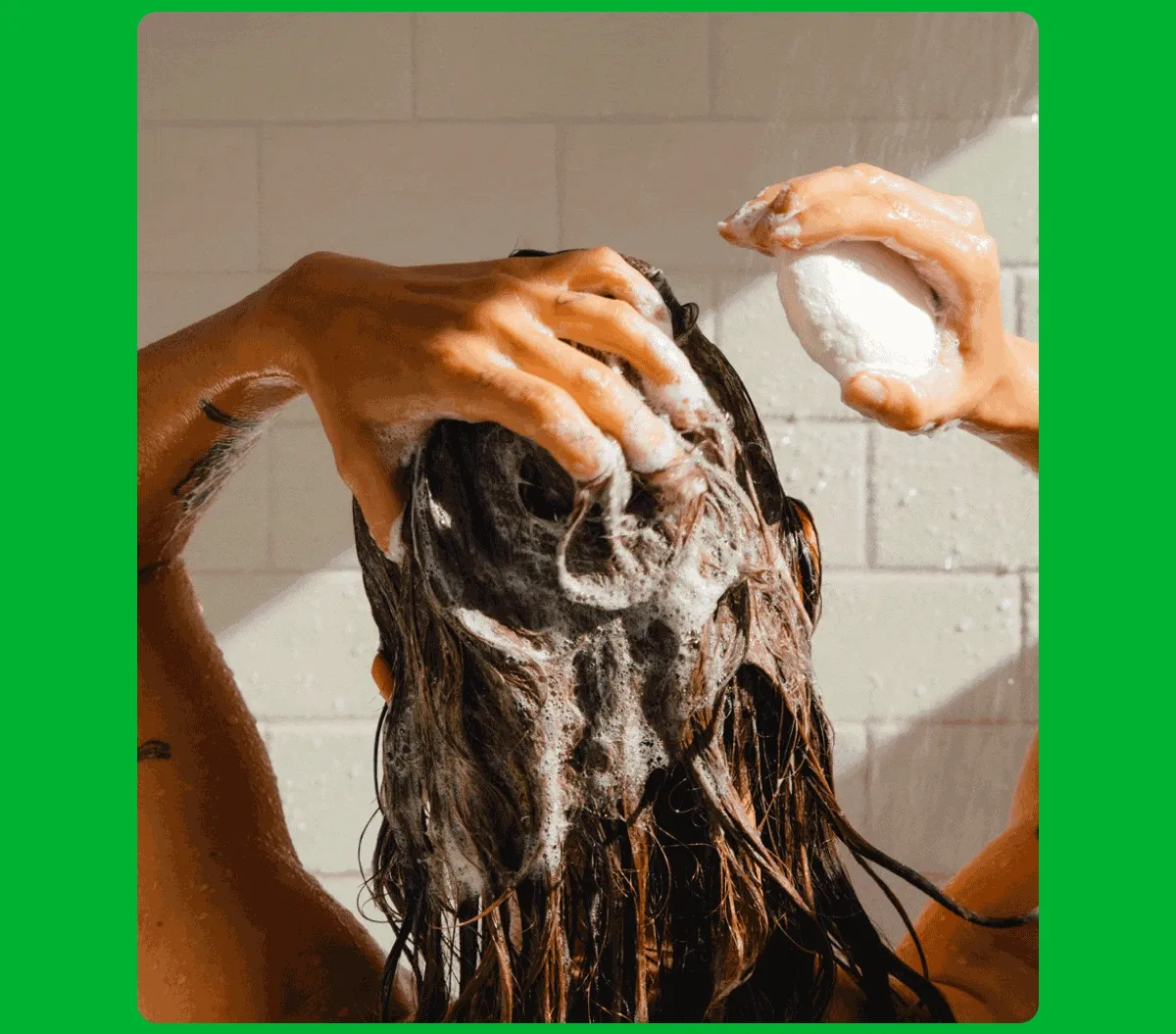 Animation: Someone washing their hair with a Good Time bar, and someone pulling a piece of Who Gives A Crap toilet paper.