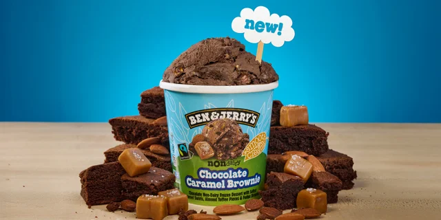 Pint of Ben & Jerry's Chocolate Caramel Brownie Non-Dairy surrounded by brownies and caramel