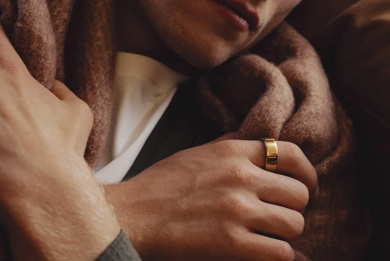 Person holding blanket wearing Oura Ring