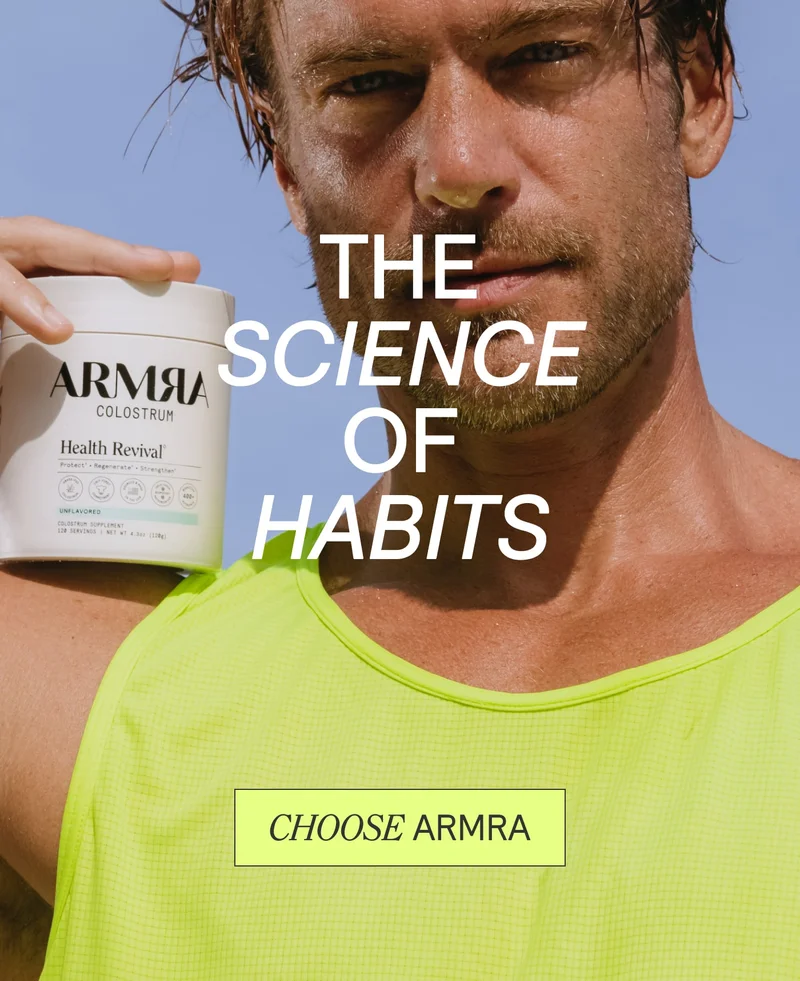 Man in neon yellow tank holding ARMRA Colostrum tub with text 'The Science of Habits' and button 'Choose ARMRA'.