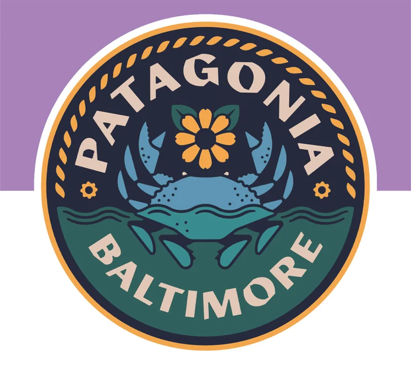 A Patagonia Baltimore store logo with a blue crab.