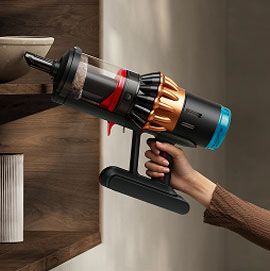 The Dyson V16 Piston Animal vacuum cleaner used in handheld mode.