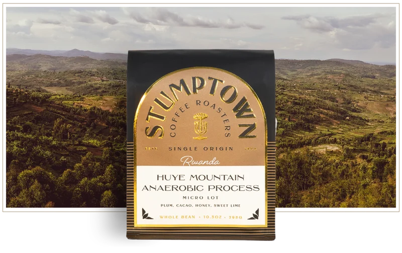 Stumptown Coffee Roasters Huye Mountain Anaerobic Process coffee bag displayed in front of a lush, rolling landscape of Rwanda, with the text “Only 240 Bags” beneath, highlighting the limited release.