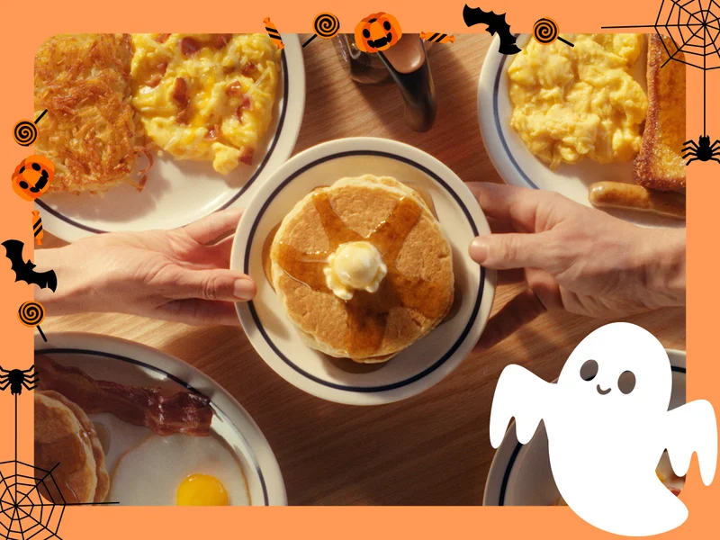 A Halloween border with spiders, bats, jack-o-lanterns and ghosts frame a shot of IHOP Value Menu dishes.